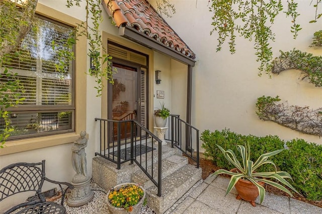 1212 River Club Dr, Sea Island, GA 31561 - property entrance featuring stucco siding and a tile roof