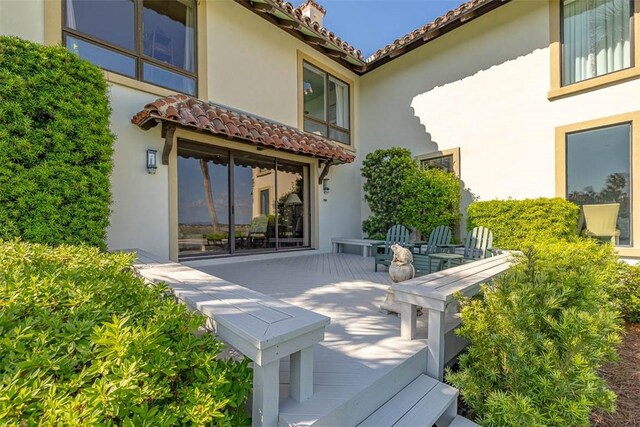 1212 River Club Dr, Sea Island, GA 31561 - back of house featuring stucco siding and a tiled roof