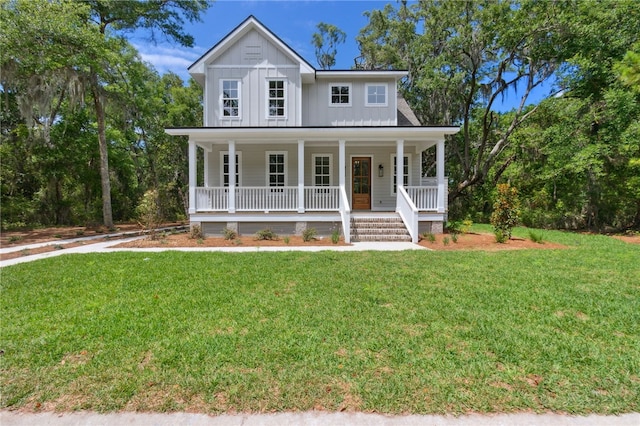 view of front of house with covered porch and a front yard