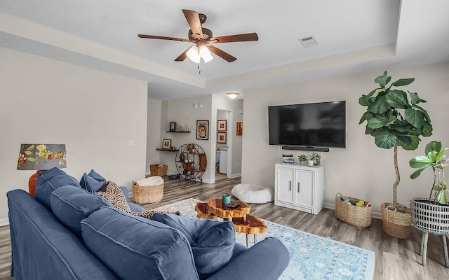 352 Pecan Pointe Dr, Brunswick, GA 31525 - living area with ceiling fan, wood finished floors, and a raised ceiling