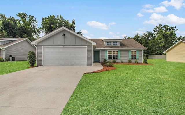 352 Pecan Pointe Dr, Brunswick, GA 31525 - ranch-style home featuring concrete driveway, a garage, a front lawn, board and batten siding, and a shingled roof