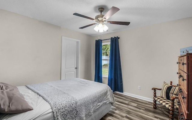 352 Pecan Pointe Dr, Brunswick, GA 31525 - bedroom with dark wood-style floors and ceiling fan