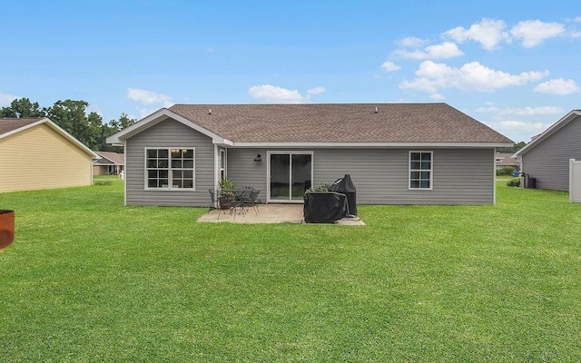 352 Pecan Pointe Dr, Brunswick, GA 31525 - rear view of property featuring a patio, a lawn, and roof with shingles