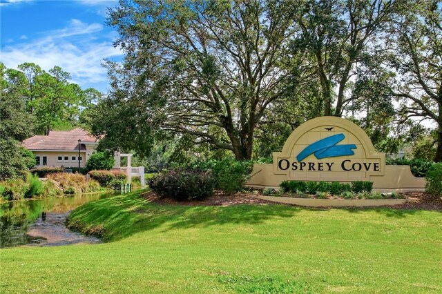 316 Chinquapin Dr, Saint Marys, GA 31558 - community sign with a yard and a water view