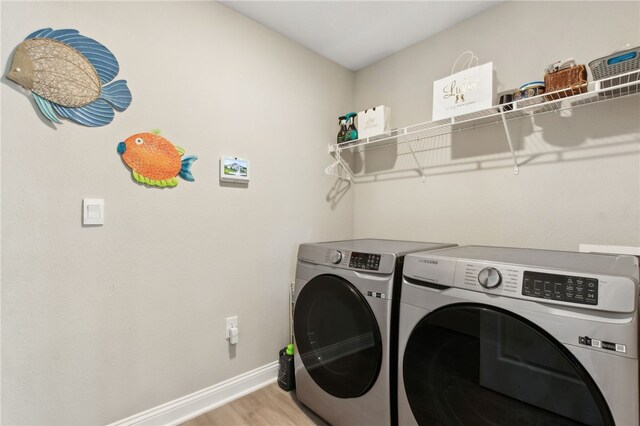 316 Chinquapin Dr, Saint Marys, GA 31558 - laundry room featuring separate washer and dryer, light wood finished floors, and baseboards