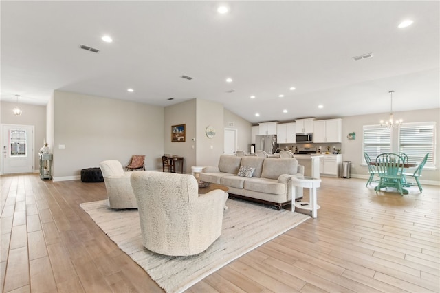 316 Chinquapin Dr, Saint Marys, GA 31558 - living area featuring light wood finished floors, a chandelier, recessed lighting, baseboards, and lofted ceiling