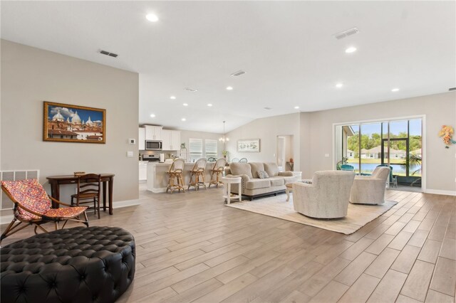 316 Chinquapin Dr, Saint Marys, GA 31558 - living room featuring light wood-style floors, plenty of natural light, recessed lighting, baseboards, and vaulted ceiling