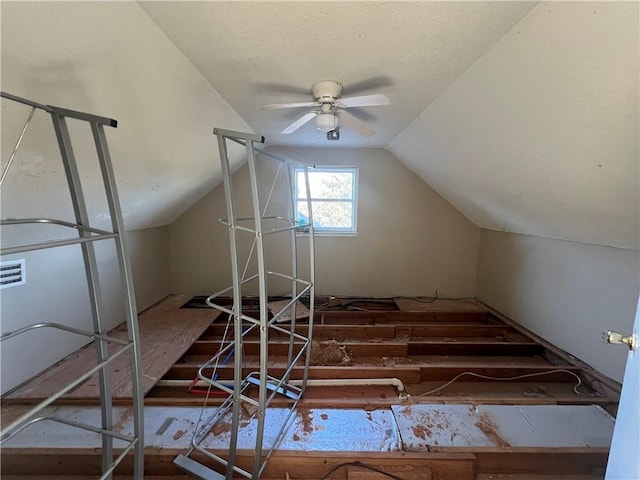 bonus room with ceiling fan and vaulted ceiling