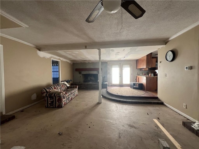 unfurnished living room featuring ceiling fan, crown molding, a textured ceiling, and french doors