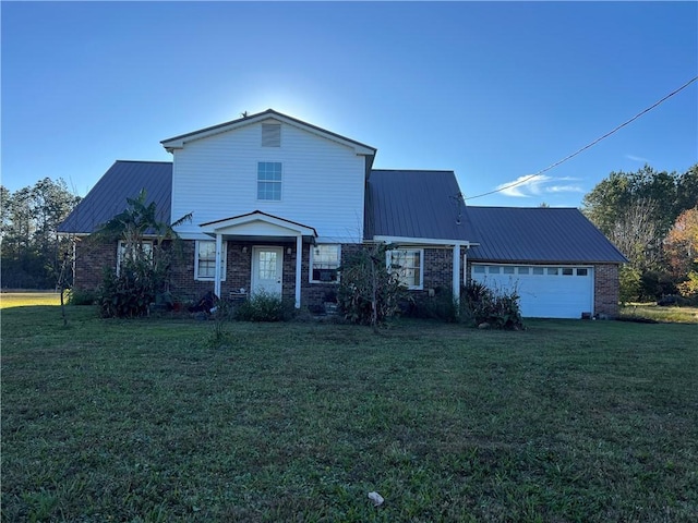 view of front of property with a garage and a front yard