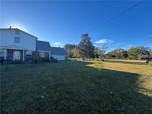 view of yard with a garage