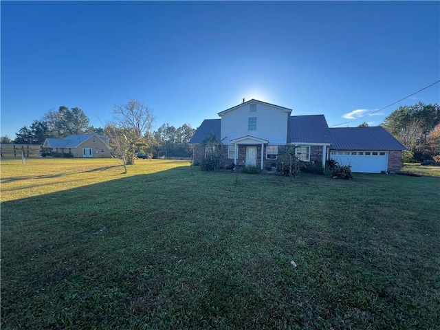 exterior space featuring a front lawn and a garage