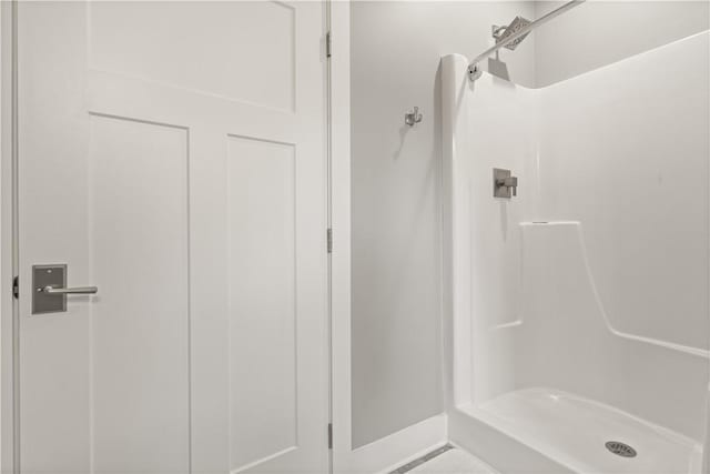 636 Old Plantation Rd, Jekyll Island, GA 31527 - full bathroom featuring a stall shower and baseboards