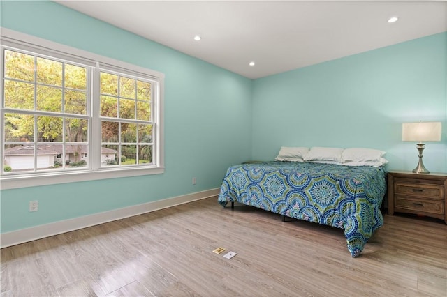 636 Old Plantation Rd, Jekyll Island, GA 31527 - bedroom with baseboards, wood finished floors, and recessed lighting