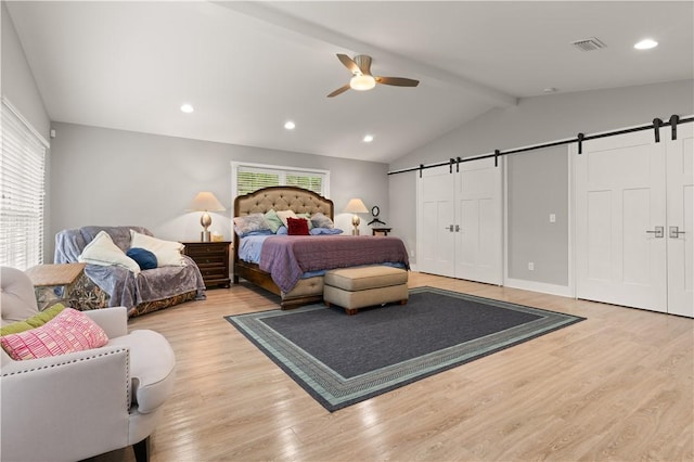 636 Old Plantation Rd, Jekyll Island, GA 31527 - bedroom featuring a barn door, light wood finished floors, recessed lighting, and ceiling fan