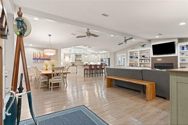636 Old Plantation Rd, Jekyll Island, GA 31527 - living area featuring a ceiling fan, light wood finished floors, a fireplace, and recessed lighting