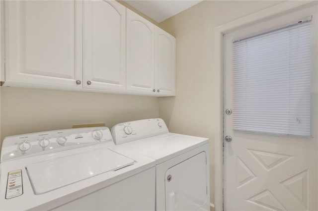 laundry area featuring cabinets and independent washer and dryer