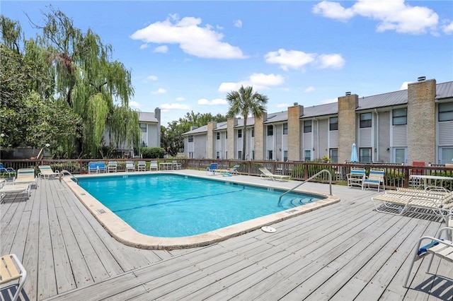 view of swimming pool featuring a wooden deck