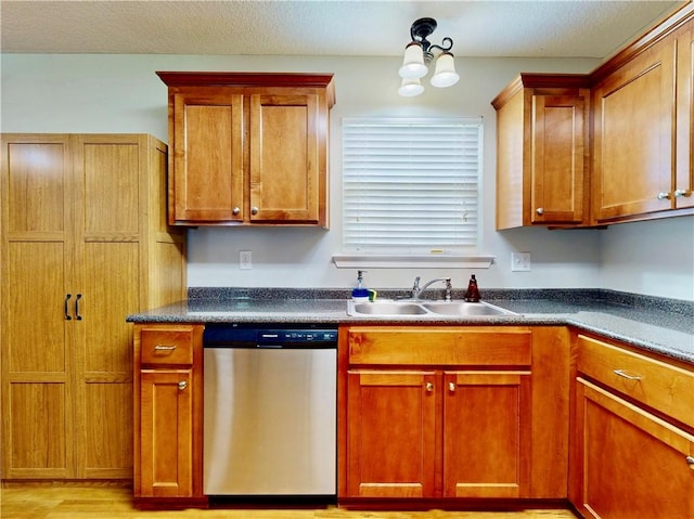 2300 Albany Ave, Waycross, GA 31503 - kitchen with stainless steel dishwasher, a sink, dark countertops, and brown cabinets