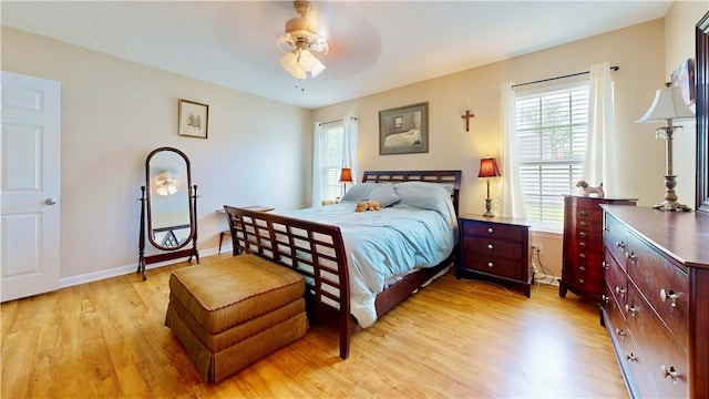 2300 Albany Ave, Waycross, GA 31503 - bedroom with light wood finished floors, baseboards, and ceiling fan