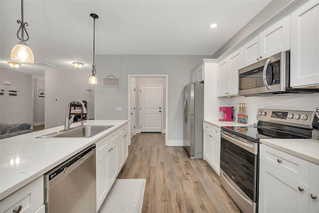63 Greyfield Dr, Brunswick, GA 31525 - kitchen featuring stainless steel appliances, a sink, light countertops, and white cabinetry