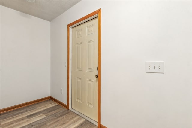 70 Buntin St, Woodbine, GA 31569 - unfurnished room featuring light wood-style floors and a textured ceiling