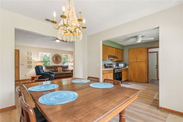 70 Buntin St, Woodbine, GA 31569 - dining space featuring ceiling fan, a chandelier, and light wood-type flooring