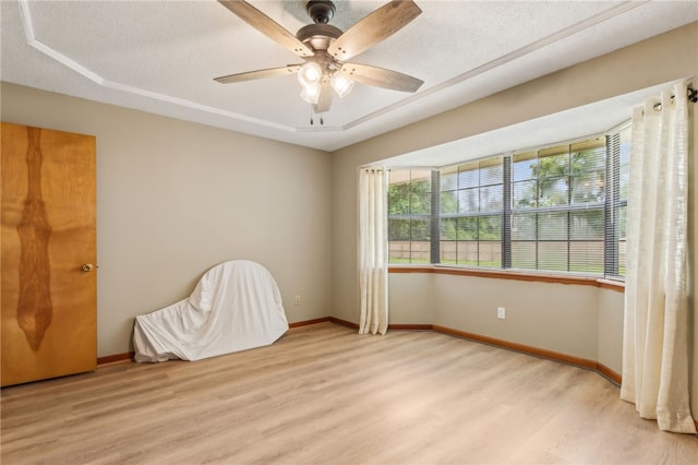 70 Buntin St, Woodbine, GA 31569 - empty room featuring light wood-style floors and a ceiling fan