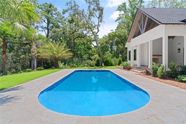 104 Point Ln, Saint Simons Island, GA 31522 - outdoor pool featuring view of scattered trees and a lawn