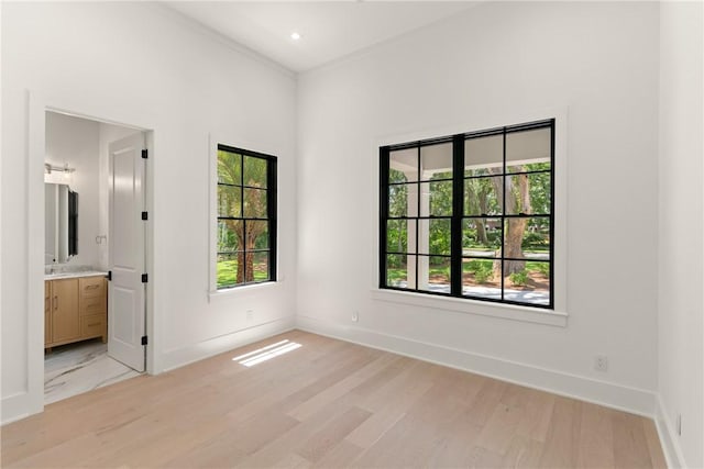 104 Point Ln, Saint Simons Island, GA 31522 - spare room with plenty of natural light and light wood-type flooring