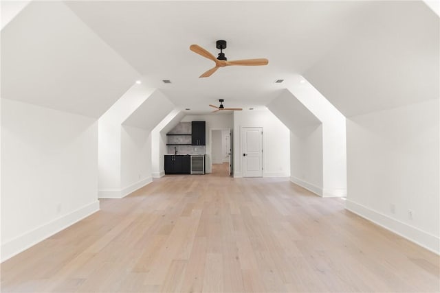 104 Point Ln, Saint Simons Island, GA 31522 - bonus room featuring ceiling fan, light wood-style flooring, vaulted ceiling, and beverage cooler