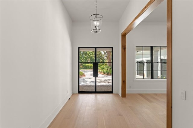 104 Point Ln, Saint Simons Island, GA 31522 - entrance foyer with light wood-style flooring and baseboards