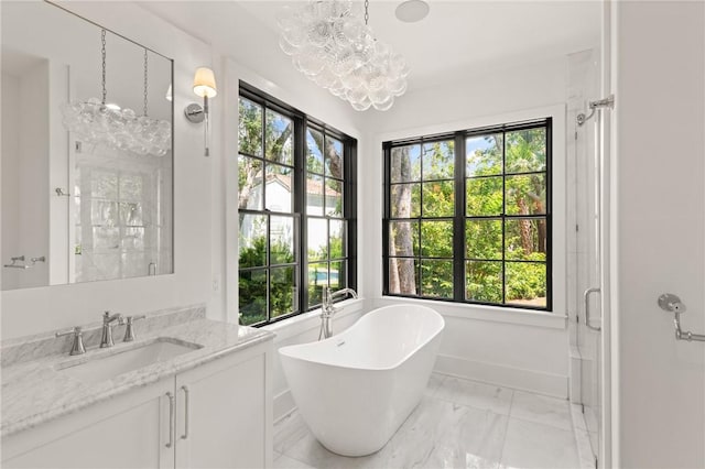 104 Point Ln, Saint Simons Island, GA 31522 - bathroom featuring a chandelier, a freestanding bath, vanity, marble finish floors, and a shower with door