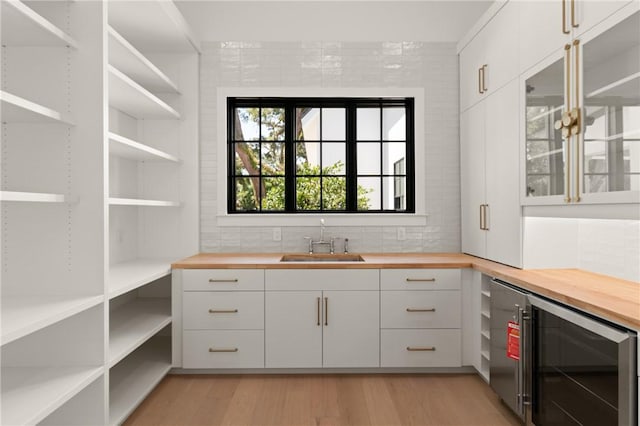 104 Point Ln, Saint Simons Island, GA 31522 - storage area featuring wine cooler and a sink