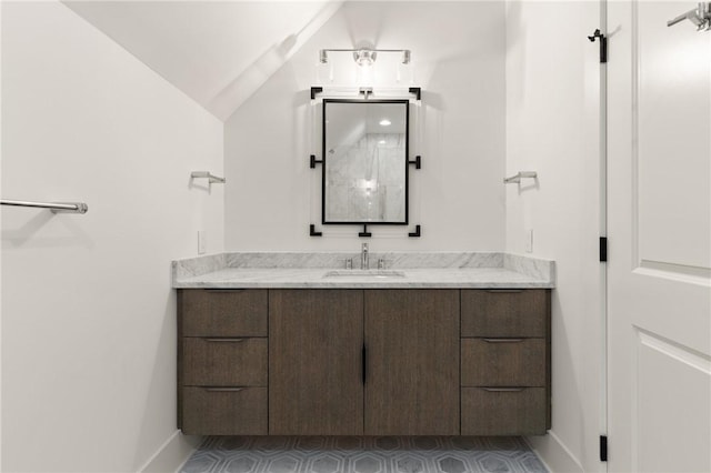 104 Point Ln, Saint Simons Island, GA 31522 - bathroom with vanity and vaulted ceiling