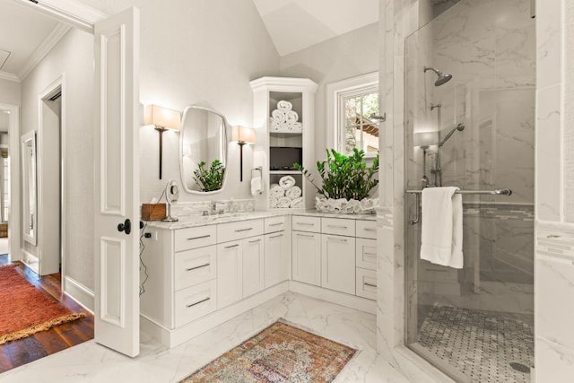 bathroom with hardwood / wood-style floors, vanity, lofted ceiling, ornamental molding, and an enclosed shower