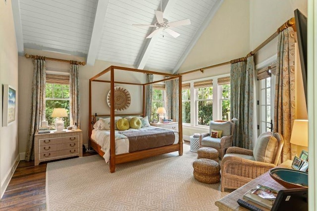 bedroom featuring ceiling fan, wood-type flooring, high vaulted ceiling, and multiple windows