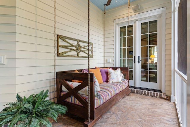 view of patio / terrace featuring ceiling fan and french doors