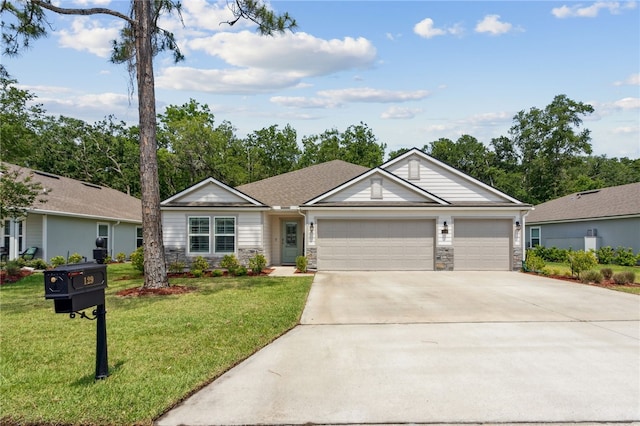 129 Chinquapin Dr, Saint Marys, GA 31558 - ranch-style home with stone siding, concrete driveway, an attached garage, and a front yard
