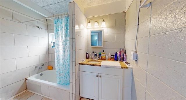 bathroom featuring tile patterned flooring, vanity, and shower / tub combo