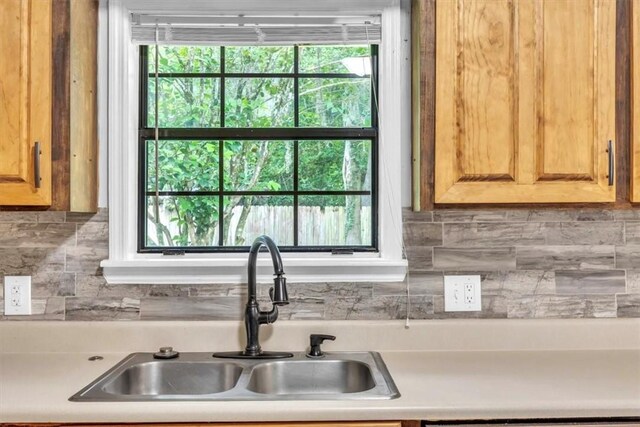 122 Tyson Ln, Allenhurst, GA 31301 - kitchen with backsplash and light countertops