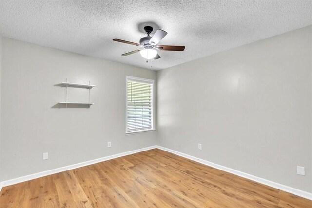 122 Tyson Ln, Allenhurst, GA 31301 - empty room featuring light wood-style floors, ceiling fan, and a textured ceiling