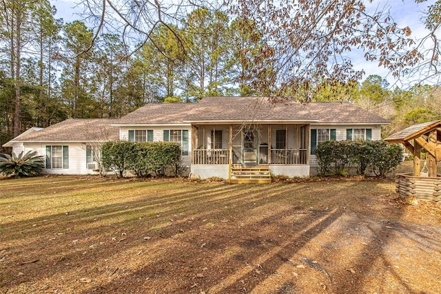 ranch-style home with a porch and a front yard