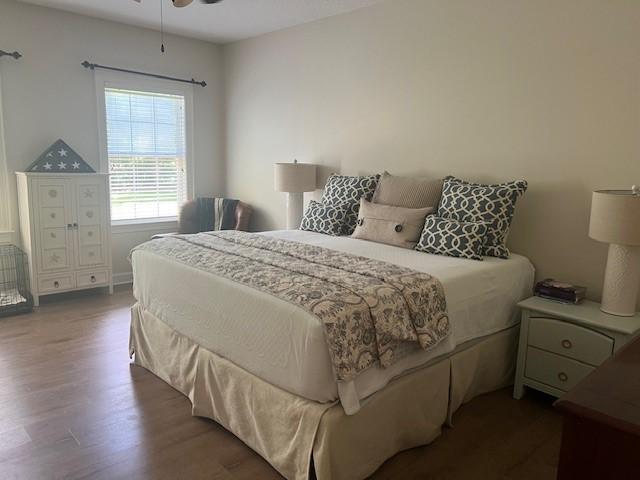 1186 Winterberry Ct NE, Townsend, GA 31331 - bedroom featuring wood finished floors