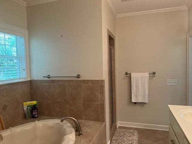 1186 Winterberry Ct NE, Townsend, GA 31331 - bathroom with vanity, ornamental molding, a garden tub, tile patterned floors, and baseboards