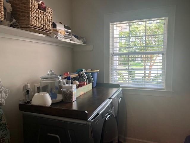 1186 Winterberry Ct NE, Townsend, GA 31331 - washroom with independent washer and dryer and plenty of natural light