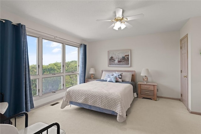12 Bliss Ln, Jekyll Island, GA 31527 - bedroom with light colored carpet and a ceiling fan