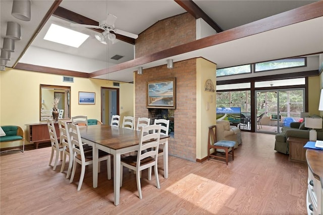 12 Bliss Ln, Jekyll Island, GA 31527 - dining area featuring high vaulted ceiling, a ceiling fan, light wood-style floors, a skylight, and beam ceiling