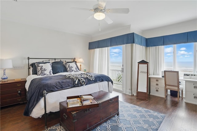 bedroom featuring access to outside, crown molding, wood finished floors, and a desk