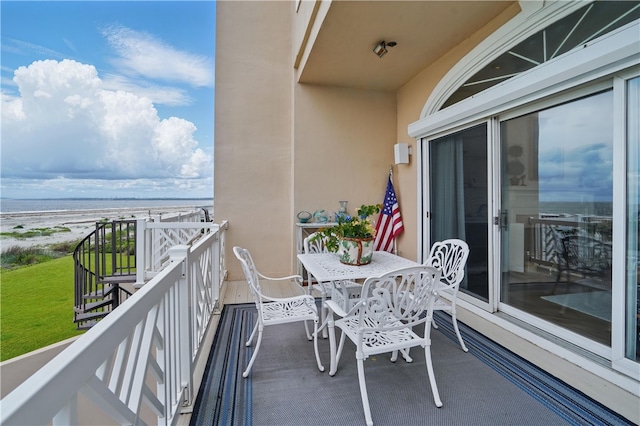 balcony featuring a water view